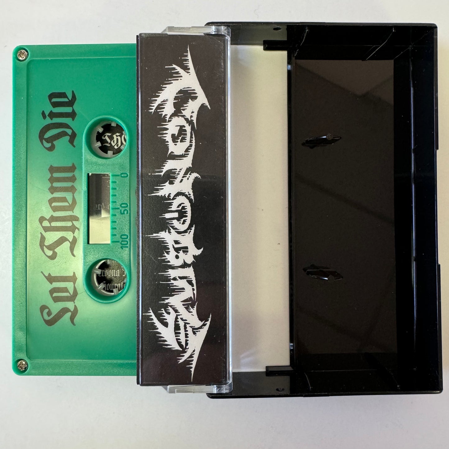 Conqbine - Let Them Die / Into a Void Overflowing cassette tape (used)