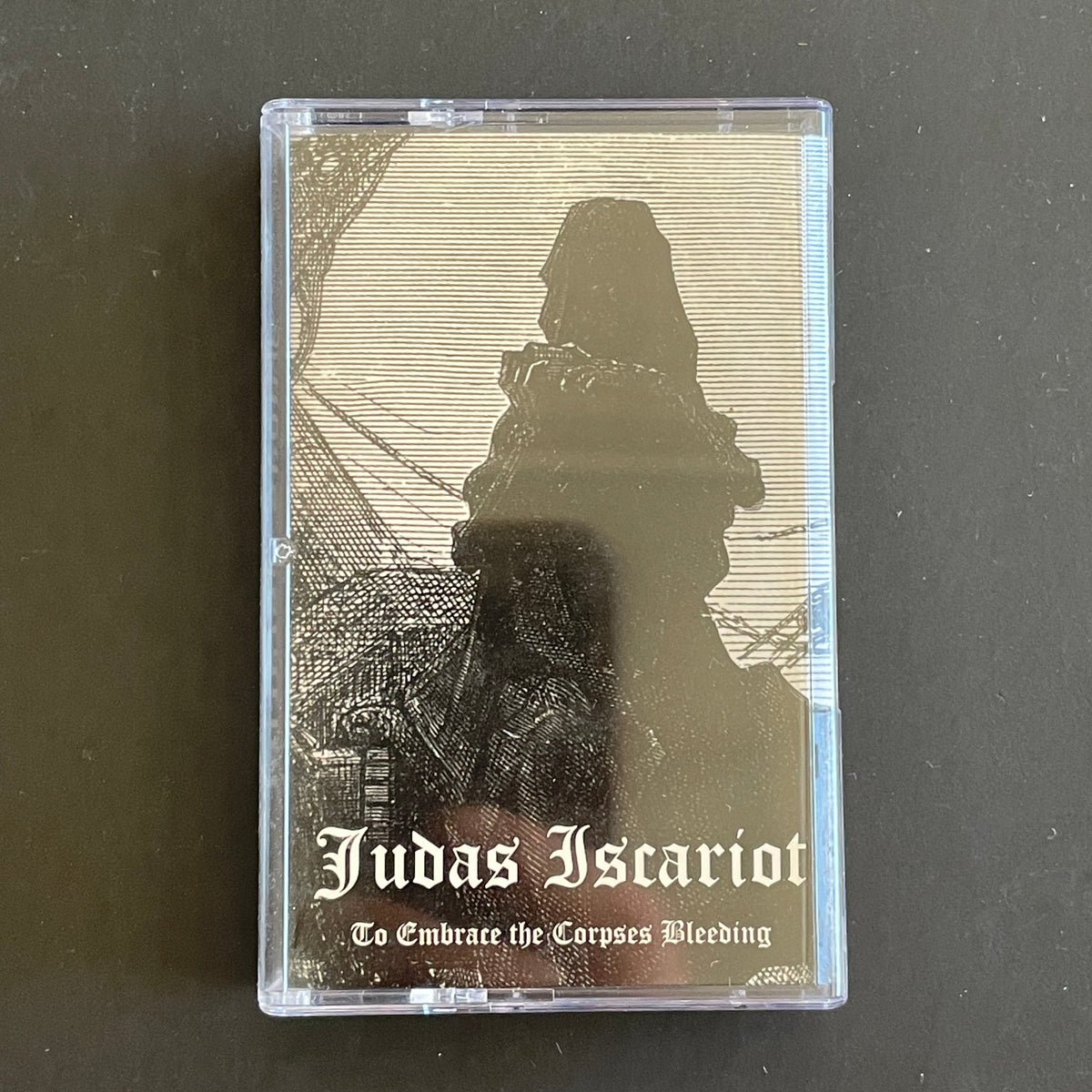 Judas Iscariot – To Embrace The Corpses Bleeding cassette tape (used)